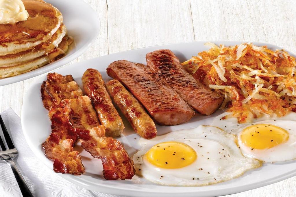 Hearty Man'S Combo · Two eggs*, smoked sausage, two Applewood smoked bacon strips and two sausage links. Served with crispy hash browns or breakfast potatoes and choice of three buttermilk pancakes, fresh baked Mammoth Muffin® or buttered toast. .