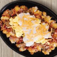 Big Country Sunrise Skillet · Pork sausage, Applewood smoked bacon, smoked ham, American cheese and cream gravy with two e...