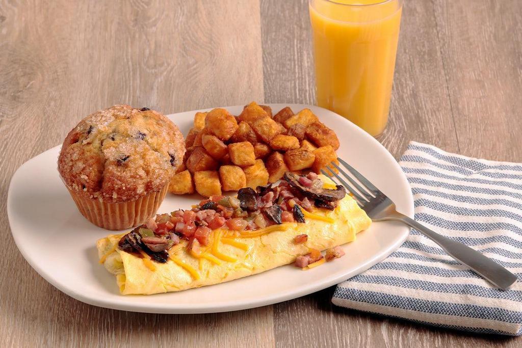 The Everything Omelet · Diced grilled ham, mushrooms, tomatoes, onions, green peppers and American cheese - this classic omelet has got it all! Served with three made-from-scratch buttermilk pancakes.
