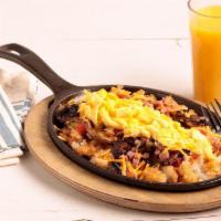 The Everything Skillet  · Grilled ham, mushrooms, green peppers, tomatoes, onions and American cheese with two eggs* s...