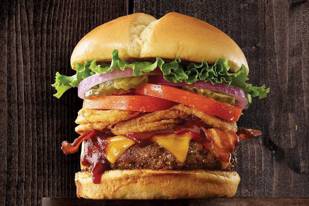 Bbq Tangler Burger · 100% Angus beef prepared medium well with a sweet BBQ sauce, Cheddar cheese, Applewood smoked bacon, crunchy Onion Tanglers®, lettuce, tomato, sweet red onions and pickles on a warm brioche bun..