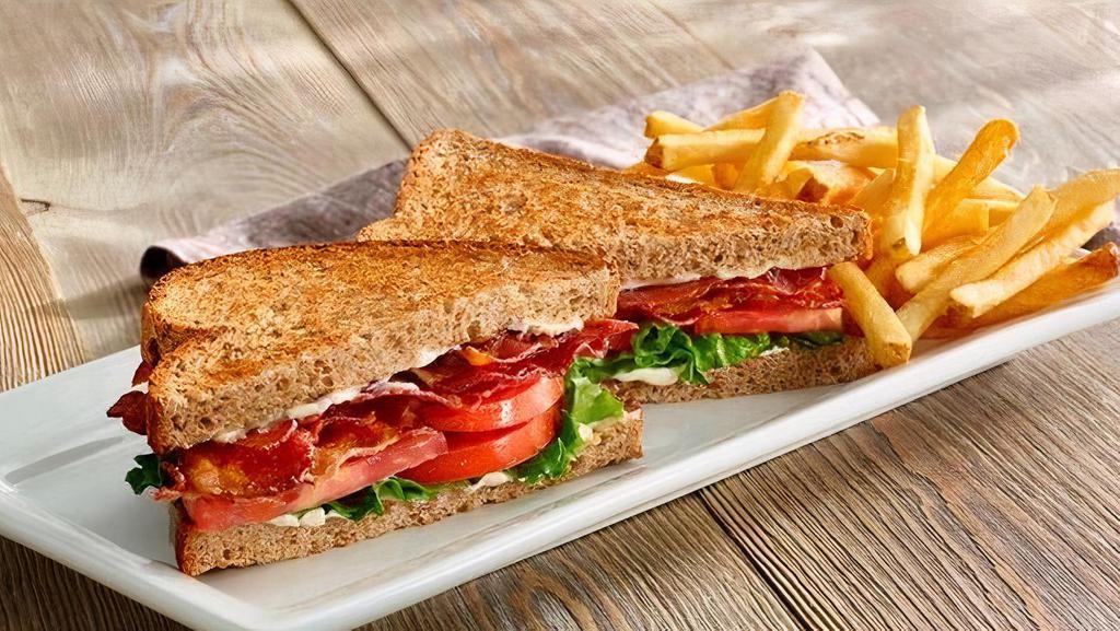 Big Bacon Blt · Six strips of crisp Applewood smoked bacon with lettuce, tomato and mayo on white or whole wheat toast. Served with fries or cup of soup..