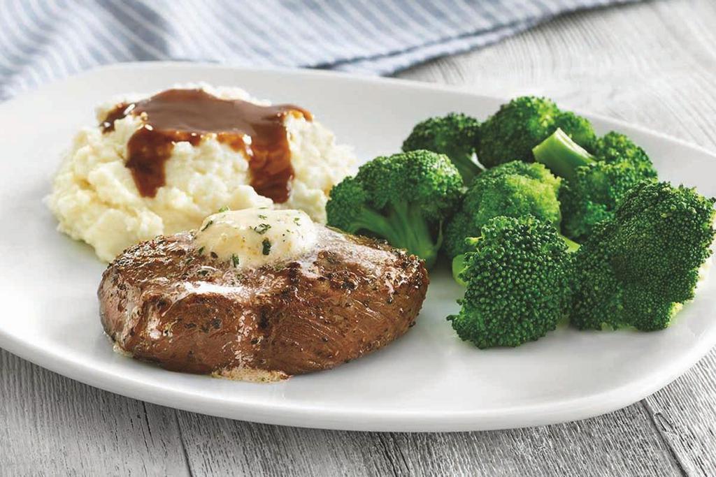 Top Sirloin Steak · USDA Choice 6 oz. grilled Top Sirloin steak*, topped with garlic butter and served with two dinner sides.