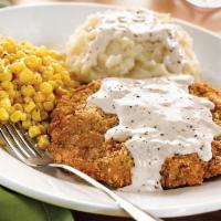 Country Fried Steak · Lightly breaded steak topped with our country-style cream gravy and served with two dinner s...
