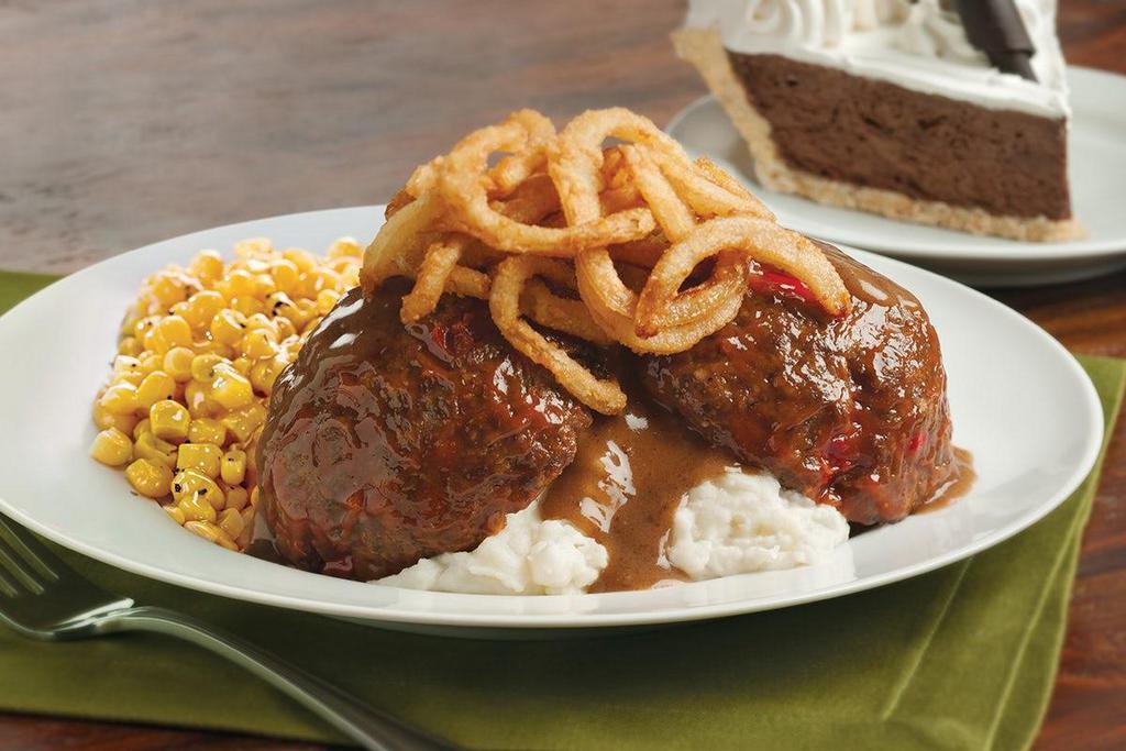 Homemade Meatloaf · Savory sweet-glazed meatloaf served over real mashed potatoes and topped with crispy onions and a rich beef gravy.  Served with one dinner side..