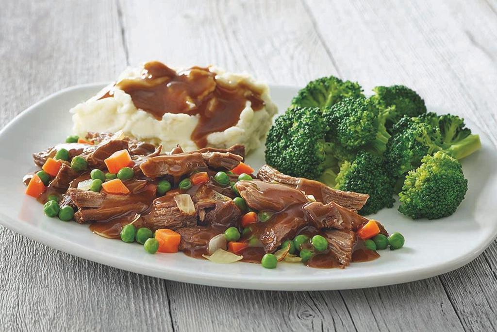 Classic Pot Roast · Tender chunks of braised beef, sweet green peas, tender carrots, onions and a hearty beef gravy. Served with two dinner sides.