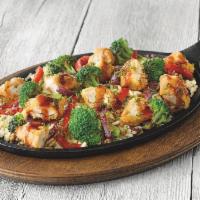 Hibachi Fried Chicken Skillet · Teriyaki-glazed fried chicken, stir-fried with red bell peppers, red onions and broccoli, al...