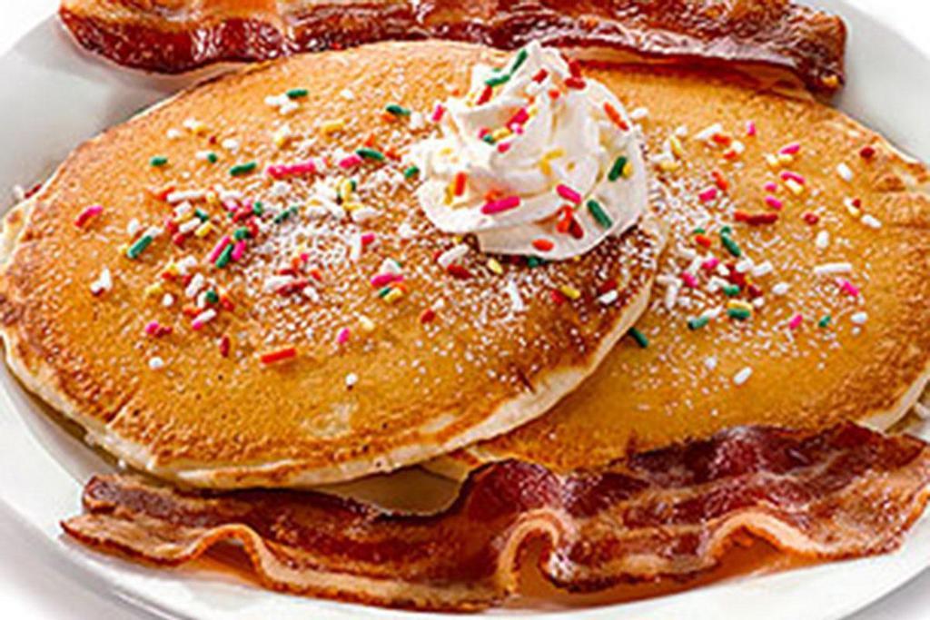 Rainbow Pancakes · Two buttermilk pancakes topped with rainbow sprinkles, whipped topping and powdered sugar. Served with choice of one side..