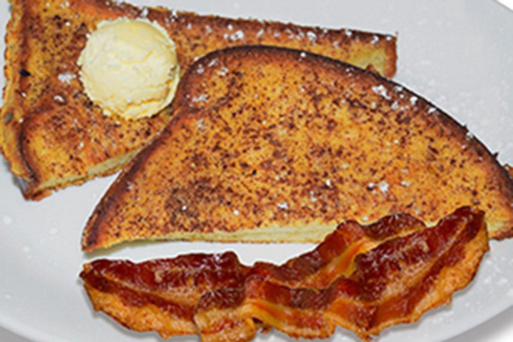 French Toast · French Toast dusted with powdered sugar and served with syrup and choice of one side..