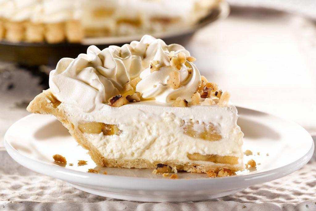 Banana Cream Pie, Slice · Loaded with hand-sliced bananas and topped with real whipped cream and chopped walnuts.. (700 cal/slice).
