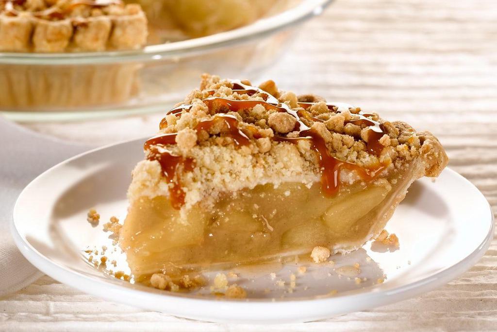 Caramel Apple Pie, Slice · Luscious apples with a crumb topping and rich caramel icing. (500 cal/slice).
