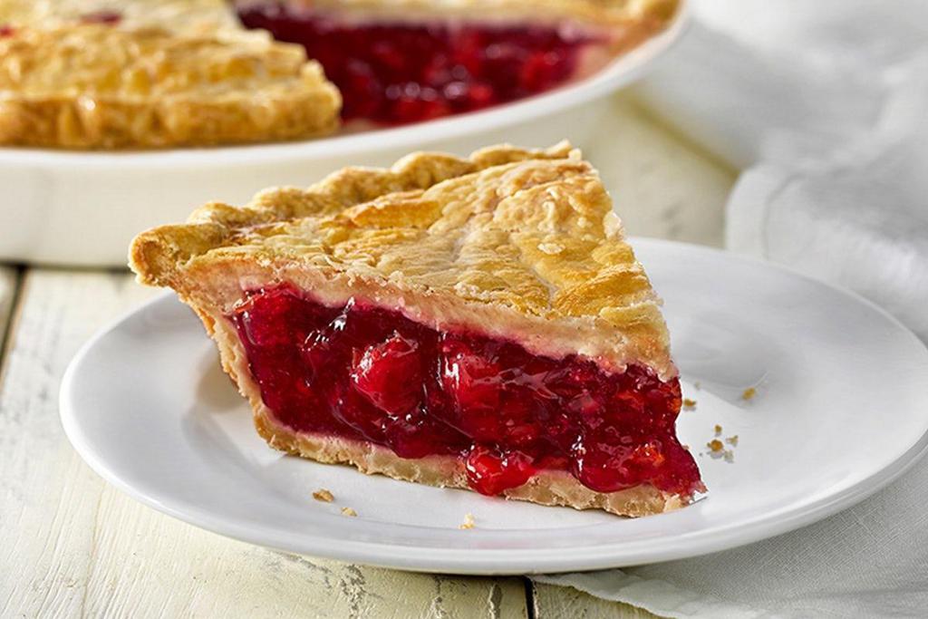 Cherry Pie, Slice · Sweet and tangy cherries baked inside a golden double crust. (580 cal/slice)