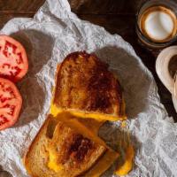 Grilled Cheese  · Vermont Sharp Cheddar, White Toast. Add bacon & tomatoes for an additional charge.