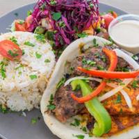 Combo Kebab  (Chicken And Kafta) · Spiced Chicken, Spiced Ground Beef and Lamb. On the side: Chopped Salad, Rice, Pita, Tahini.