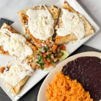 Quesadillas · Choice or 3 corn or large flour tortilla stuffed with melted cheese, topped with crema & que...