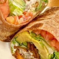 Avocado Blt Wrap · Smoked tempeh bacon, house-made breaded onions, avocado chunks, lettuce, tomato & creamy veg...