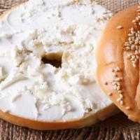 Sesame Bagel With Cream Cheese · Fresh homemade sesame bagel smothered with cream cheese. Choice of add-ons available.