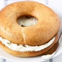 Whole Wheat Bagel With Cream Cheese · Fresh homemade whole wheat bagel smothered with cream cheese. Choice of add-ons available.