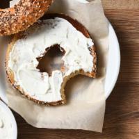 Poppy Bagel With Cream Cheese · Fresh homemade poppy bagel smothered with cream cheese. Choice of add-ons available.
