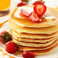 Strawberry Buttermilk Pancakes · 3 perfectly fluffy strawberry pancakes served with a side of butter and syrup. Choice of add...