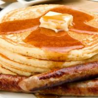 Pork Sausage Buttermilk Pancakes · 3 perfectly fluffy pancakes topped with pork sausage served with a side of butter and syrup....