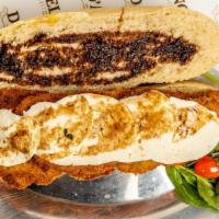 Christian Caprese · Chicken cutlet, fresh mozzarella, roasted peppers, balsamic glaze.