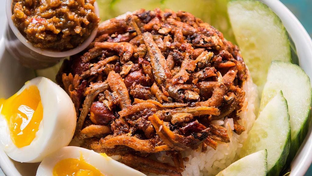 Nasi Lemak · national dish of Malaysia: coconut rice, fried anchovies, cucumber, peanuts, hard boiled egg, side of house sambal sauce