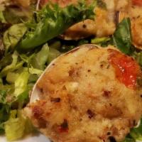 Baked Clams · Fresh chopped clams stuffed with our house-made stuffing with bacon bits; baked and served w...