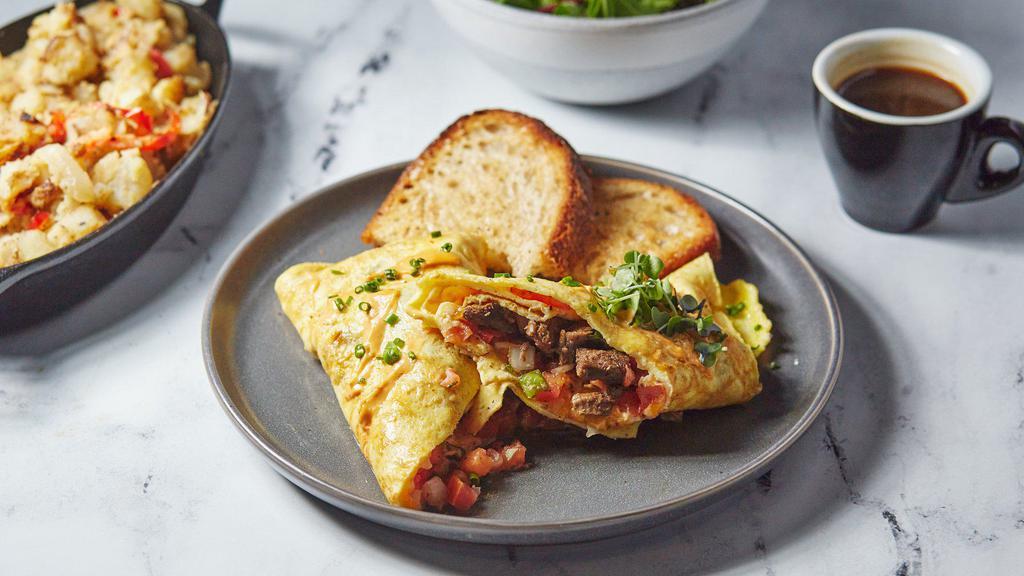 Build Your Own Omelette Combo · Create your own omelette with four fluffy eggs, your choice of protein, toppings, and sauce. Served with tater tots or salad and toast.