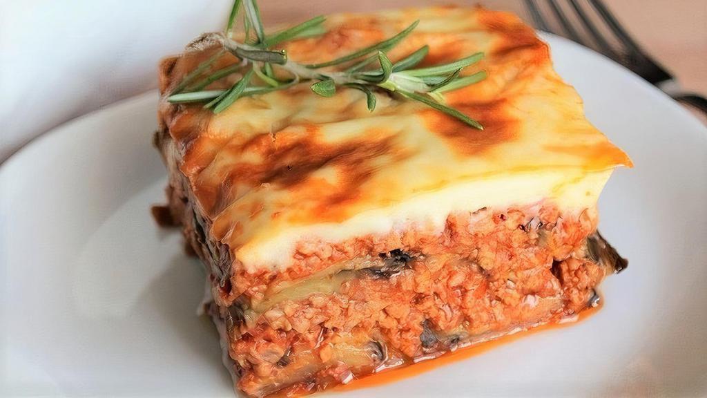 Moussaka  · Layered ground beef with grilled eggplant and bechamel sauce, cooked in the oven..just yummy!