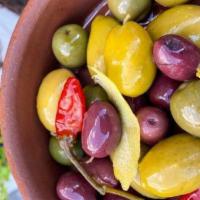 Olives · Mixed marinated olives and pickled peppers. vegan. vegetarian. gluten-free. dairy-free.
