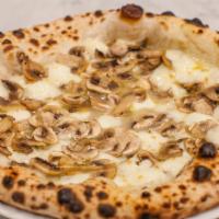 Tartufo Pizza · Mozzarella di Bufala D.O.P, organic cremini mushrooms, Parmigiano Reggiano D.O.P., and white...