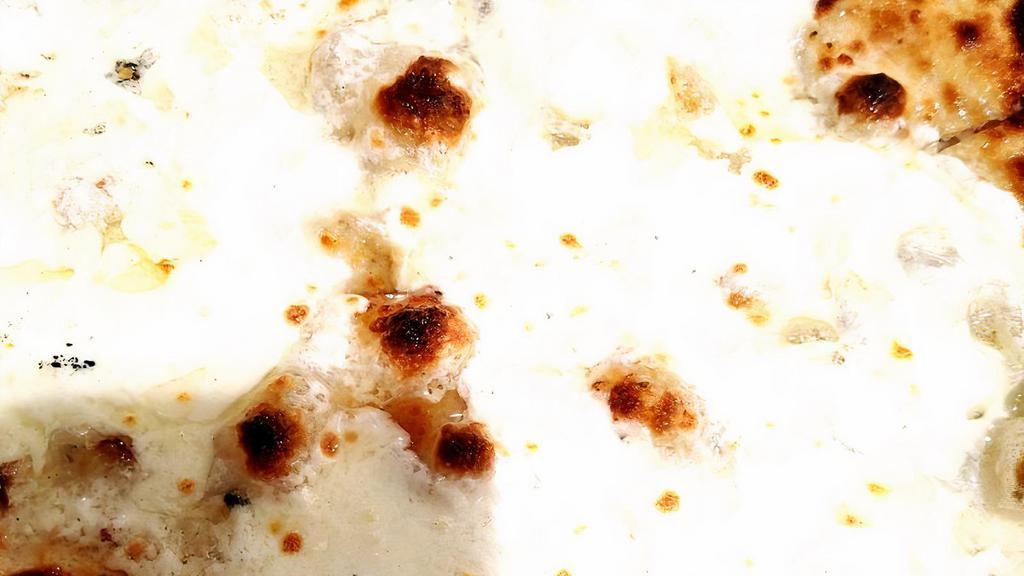 Truffles E Artichokes Pizza · Urbani artichokes and truffle cream, burrata, and white truffle oil.