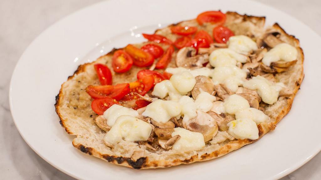 Vegetarian Truffle Sandwich · Fresh mozzarella, Urbani truffle and artichoke cream, grape tomatoes, organic cremini mushrooms and white truffle oil.