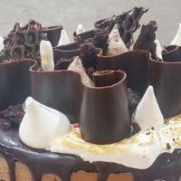 Special Triple Chocolate Cake Slice With Whipped Cream · Chocolate cake filled with chocolate cream, hazelnut cream and hazelnut crunch, finished wit...
