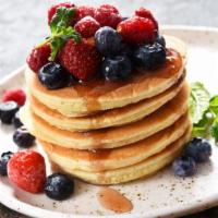 Berry Pancakes · 3 freshly made pancakes, topped with syrup and your choice of berries.