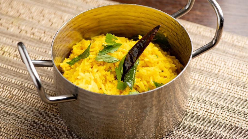 Lemon Rice · Tempered mustard seeds and curry leaves.