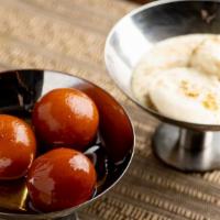 Gulab Jamun · Fried cheese ball and sweet syrup.