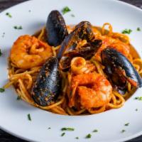 Seafood Pasta · Served with Mussels , Calamari & Shrimps in marinara sauce.
