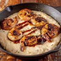 Shrimp And Grits · Spicy. Grilled jumbo shrimp served over bacon and cheese grits with honey chipotle sauce.