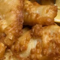 Fish And Chips · Beer battered cod loin. Served with tater tots.