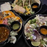 Tacos Ensenada (3) · Beer-battered shrimp or fish, pico de gallo, mayo, red cabbage, guacamole sauce and cream wi...