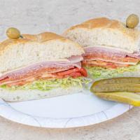 The Soprano Sandwich · Ham cappicola, salami, pepperoni, provolone, lettuce, tomato, roasted peppers, oil and vineg...