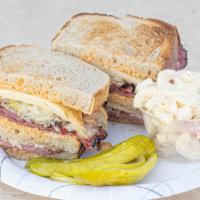 Triple Decker Reuben · 3 mouth watering layers of Naval pastrami, juicy corned beef, sauerkraut and Russian dressin...