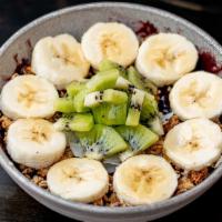 Tropic Buzz Acai Bowl · Organic acai base, kiwi, banana, vegan GF granola, unsweetened coconut shavings, honey.