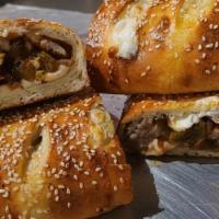 Sausage & Pepper Stromboli · Sweet Italian Sausage / Roasted Peppers / Our Homemade Fresh Mozz
