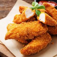 Chicken Tenders · Fresh batch of chicken fingers served with celery, carrots, and honey mustard.