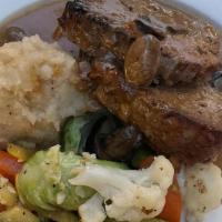 Mom'S Meatloaf · Brown gravy, mushrooms, garlic mashed potatoes, seasonal vegetables.