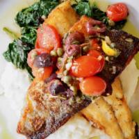 Grilled Branzino · sautéed spinach, garlic mashed potatoes, lemon, capers, olives, tomatoes, olive oil