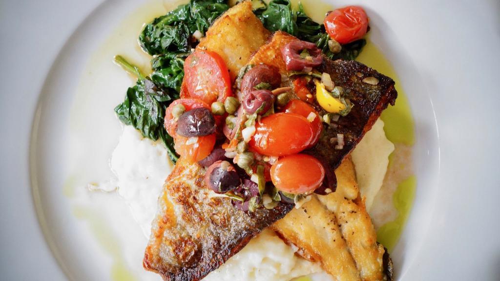 Grilled Branzino · sautéed spinach, garlic mashed potatoes, lemon, capers, olives, tomatoes, olive oil